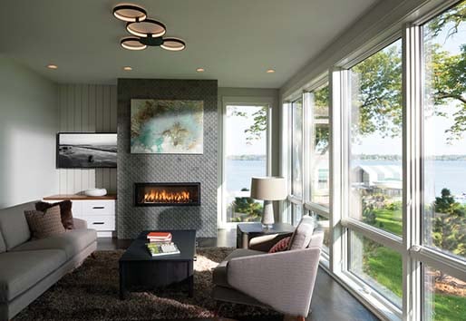 Cozy living room with view out of Andersen 400 series awning windows.