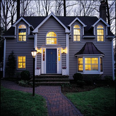 Exterior of grey home with 400 Series bay windows