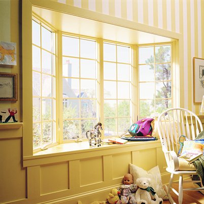 Interior of home with Andersen 400 Series bay windows with colonial grilles.